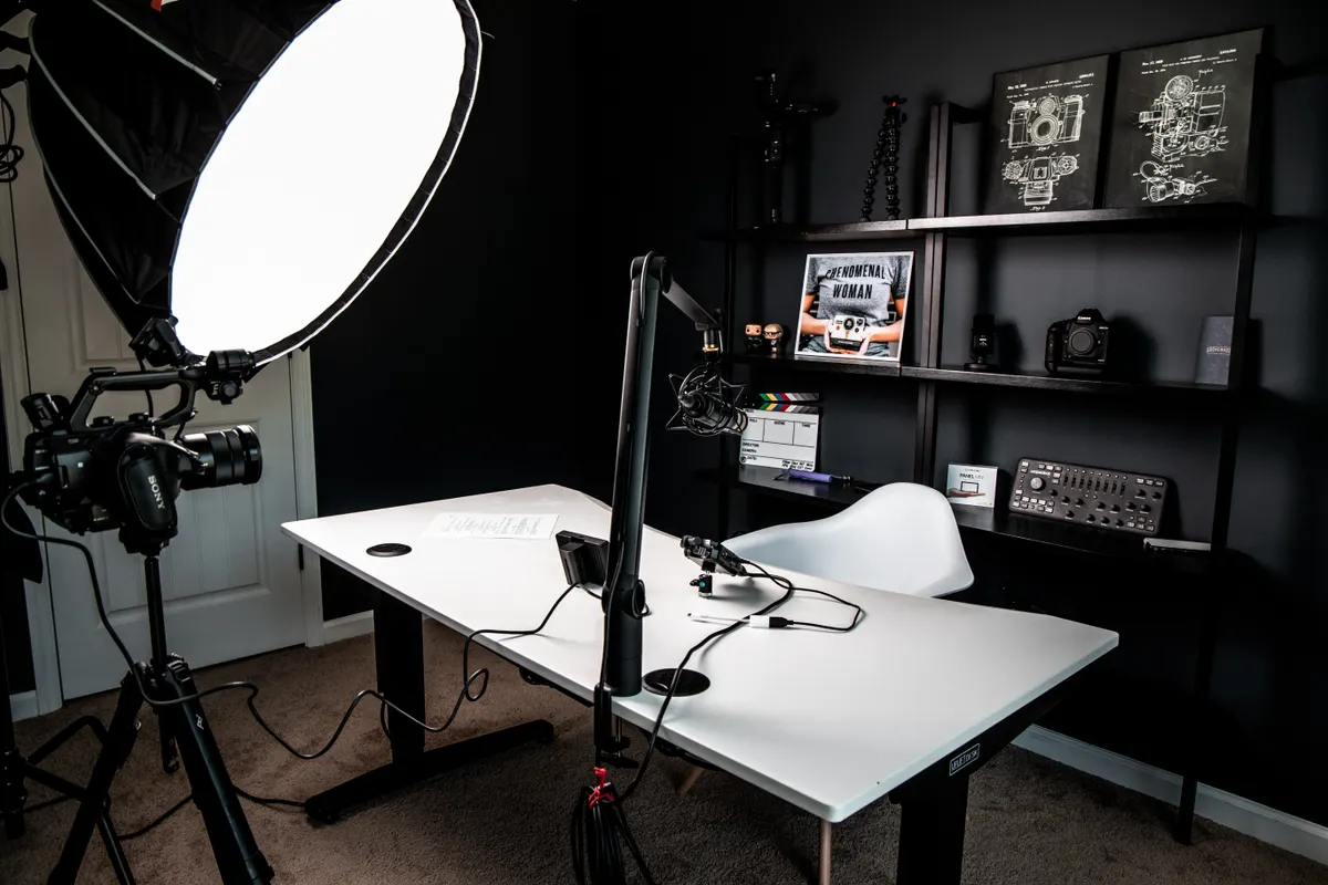 Home video studio with lights and a camera set up for filming